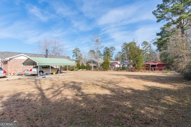 view of yard with a carport