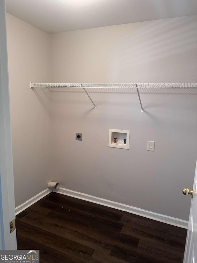 laundry room featuring hookup for a washing machine, electric dryer hookup, and dark wood-type flooring