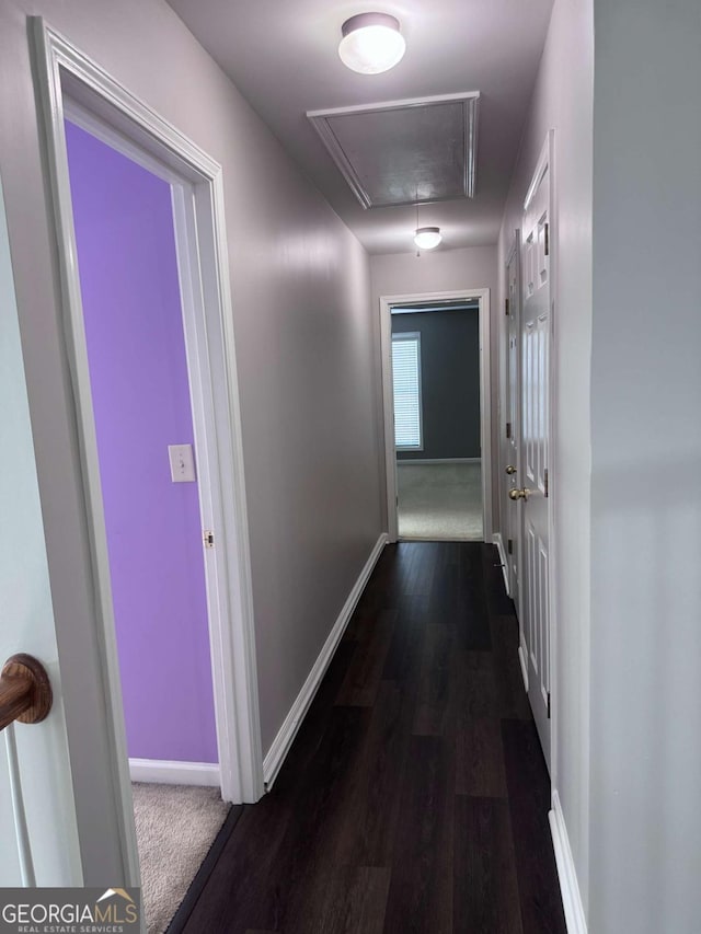 corridor with dark hardwood / wood-style floors