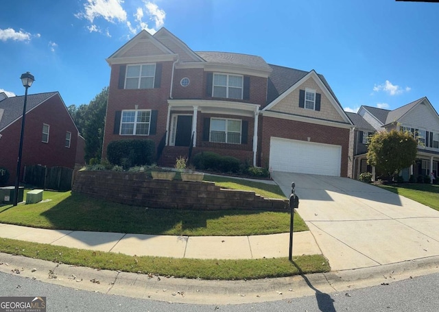 view of front facade with a garage and a front yard