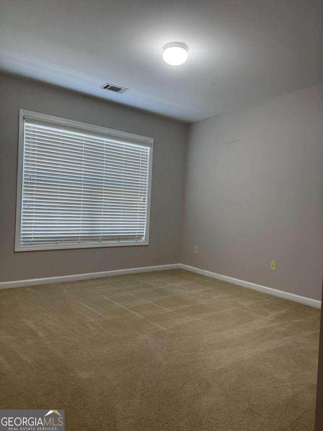 view of carpeted spare room