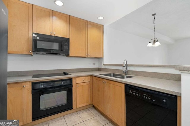 kitchen with sink, hanging light fixtures, light tile patterned floors, a notable chandelier, and black appliances