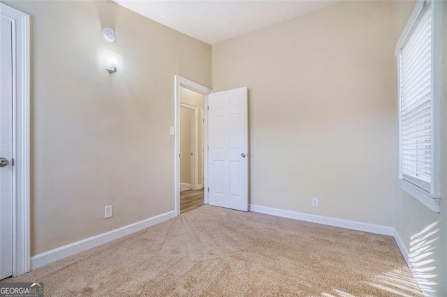 unfurnished bedroom with light carpet