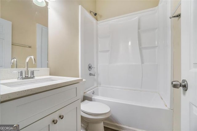 full bathroom with vanity, shower / washtub combination, and toilet