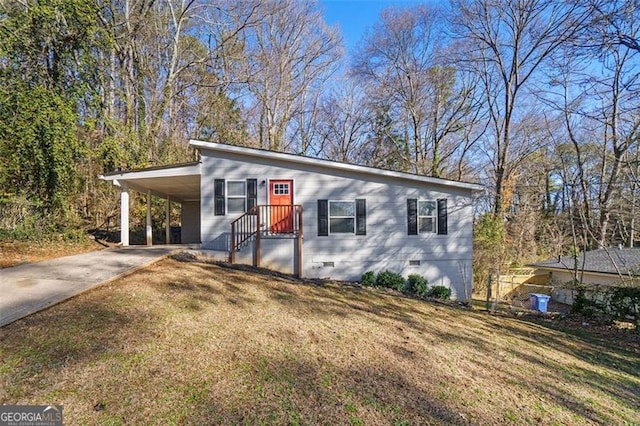 view of front facade featuring a carport and a front yard