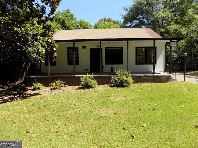 view of front of home featuring a front yard and covered porch