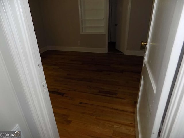 spare room featuring dark hardwood / wood-style floors