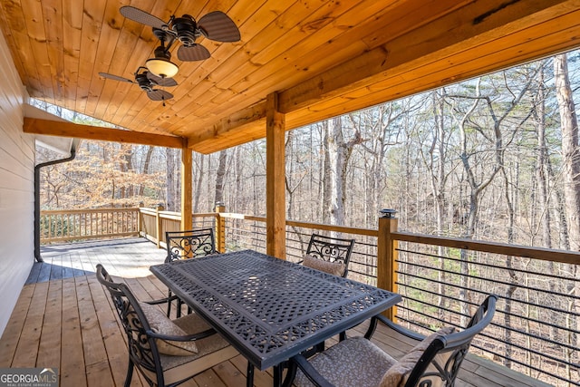 wooden deck featuring ceiling fan