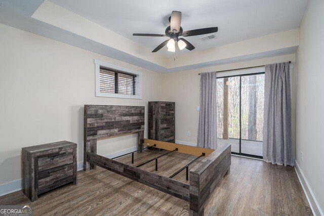 122 Acadia Dr Unit 110, Ellijay, GA 30540 - bedroom with baseboards, a raised ceiling, visible vents, and wood finished floors