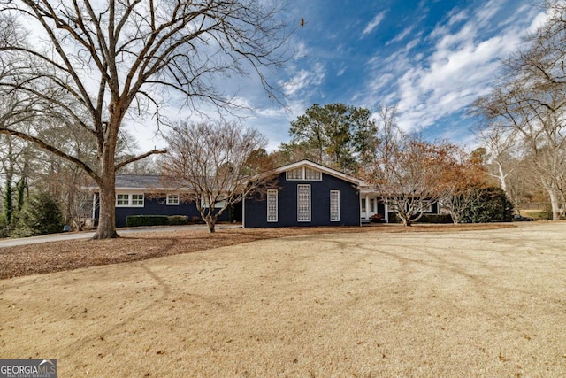 view of home's exterior with a lawn