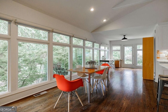 sunroom / solarium with vaulted ceiling