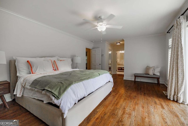 bedroom with crown molding, hardwood / wood-style flooring, ensuite bath, and ceiling fan