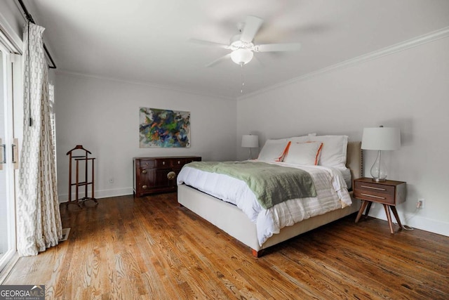 bedroom featuring wood-type flooring, ornamental molding, and ceiling fan