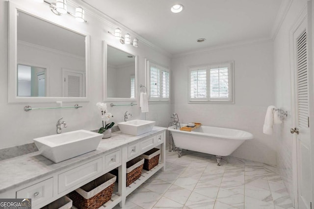 bathroom with crown molding, vanity, a bathing tub, and tile walls