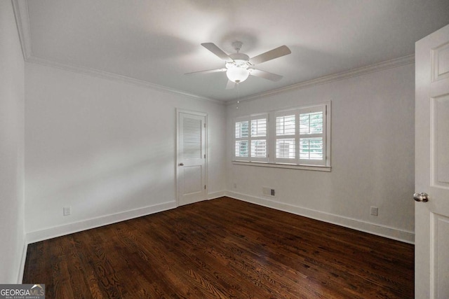 spare room featuring crown molding, ceiling fan, and dark hardwood / wood-style floors