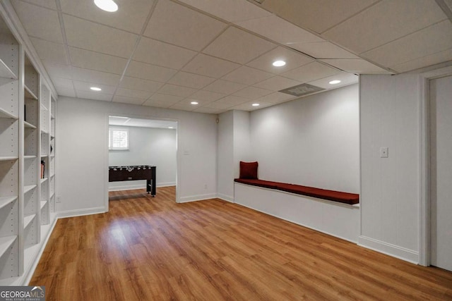 basement featuring light wood-type flooring