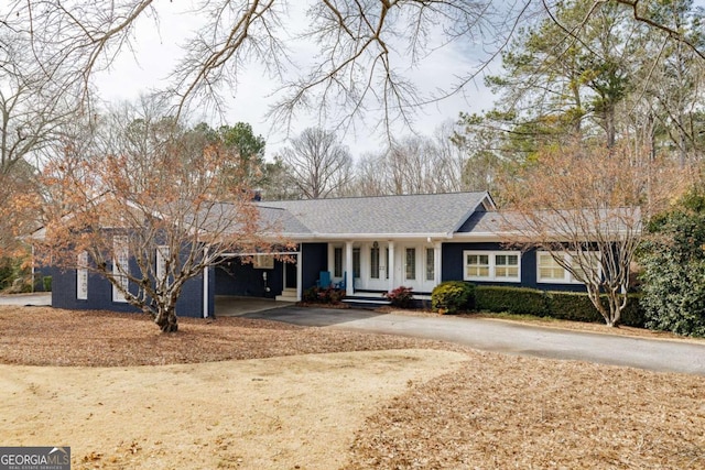 single story home with a carport