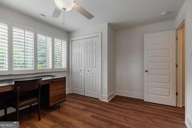 office area with ceiling fan and dark hardwood / wood-style flooring