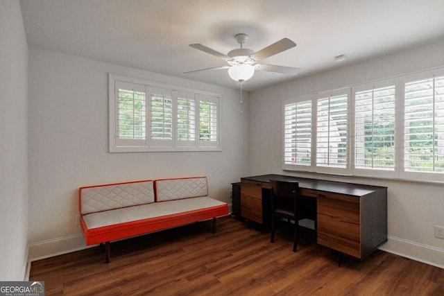 home office featuring ceiling fan, dark hardwood / wood-style floors, and a wealth of natural light