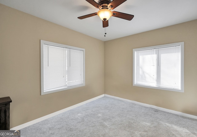 carpeted empty room with ceiling fan