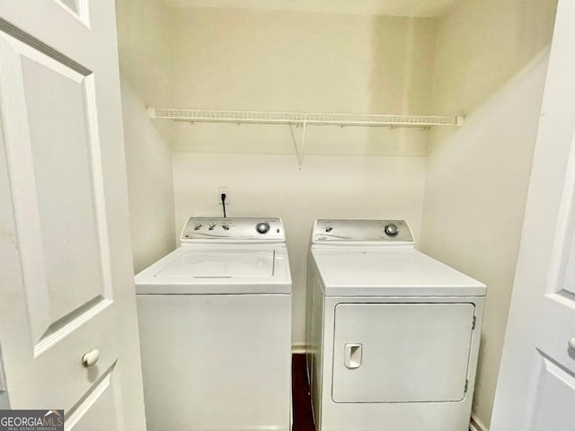 clothes washing area featuring washer and dryer