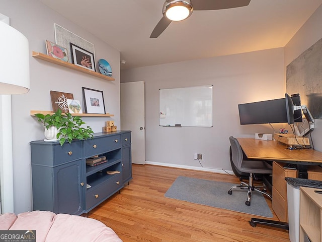 office area with light hardwood / wood-style flooring and ceiling fan