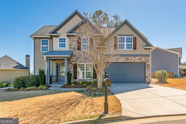 craftsman-style house featuring a garage, driveway, stone siding, a standing seam roof, and a front yard