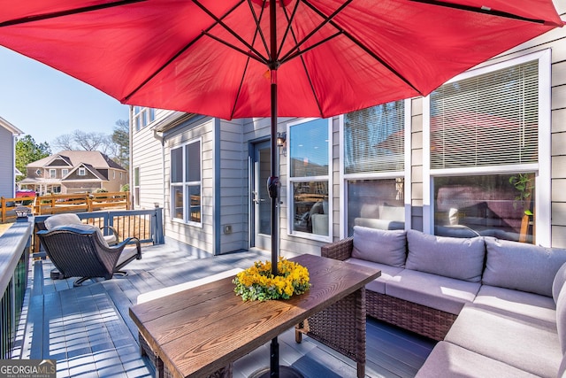 deck featuring outdoor lounge area