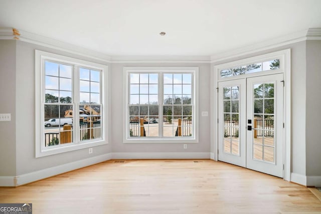 unfurnished sunroom featuring french doors