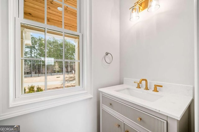 bathroom with vanity and plenty of natural light