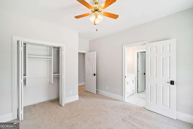 unfurnished bedroom featuring light colored carpet, a closet, and ceiling fan