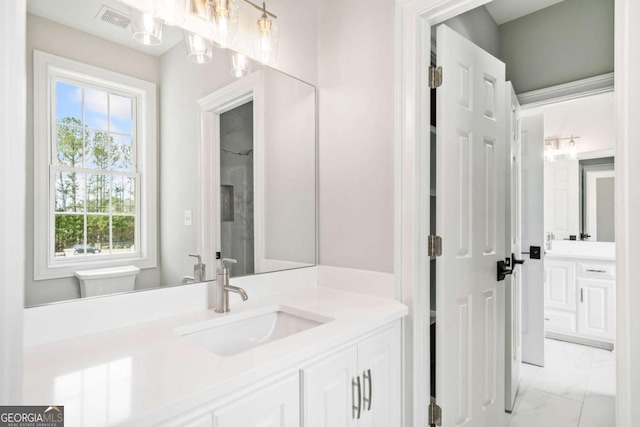 bathroom with vanity and toilet