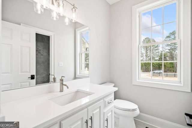 bathroom with vanity and toilet