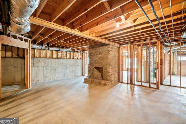 basement with a brick fireplace