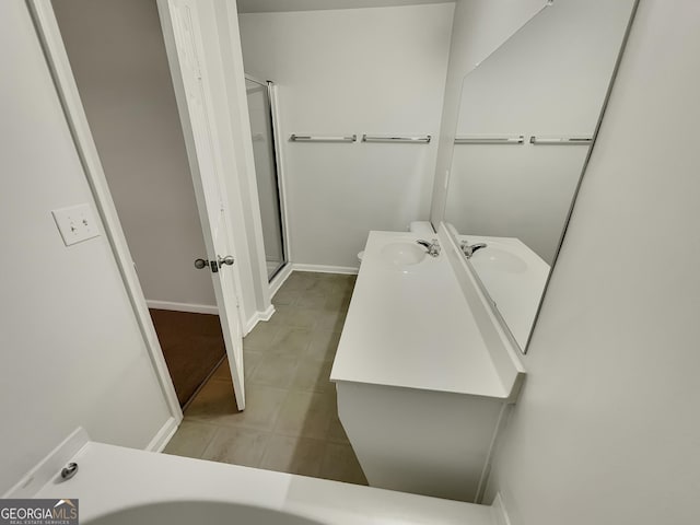 bathroom with vanity and an enclosed shower