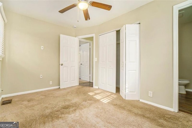 unfurnished bedroom with ceiling fan and carpet