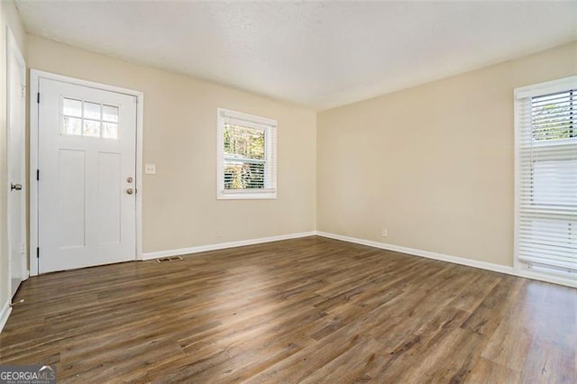 foyer featuring dark hardwood / wood-style floors