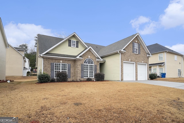 front of property with a garage and a front lawn