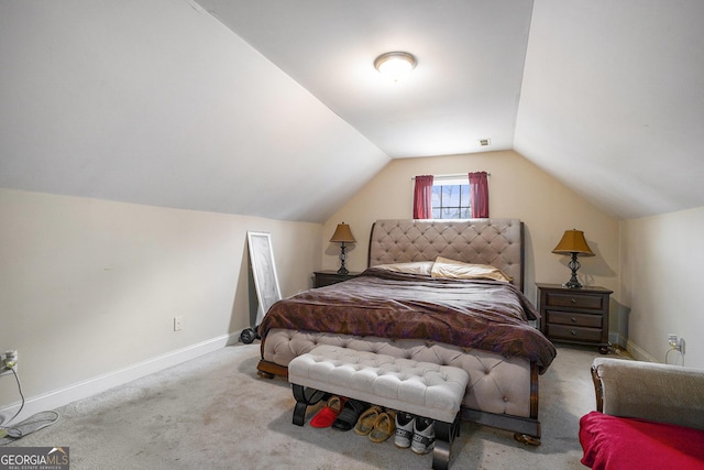 carpeted bedroom with vaulted ceiling