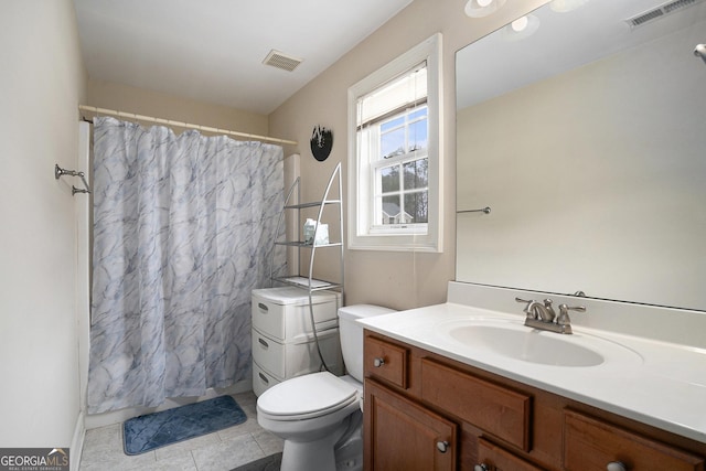 bathroom with a shower with curtain, vanity, tile patterned floors, and toilet