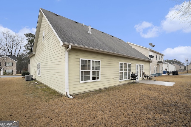 back of house featuring a patio, a yard, and cooling unit