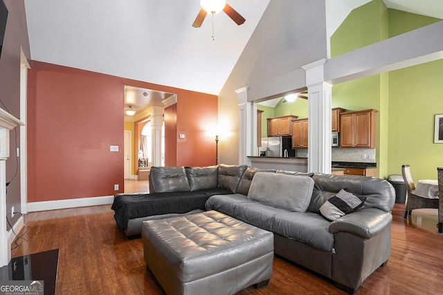 living room featuring decorative columns, ceiling fan, high vaulted ceiling, and dark hardwood / wood-style flooring