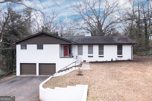 single story home featuring a garage