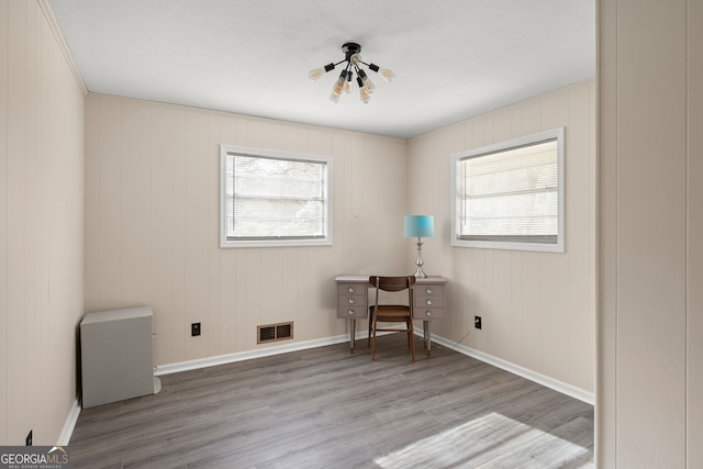 interior space with hardwood / wood-style flooring and a healthy amount of sunlight