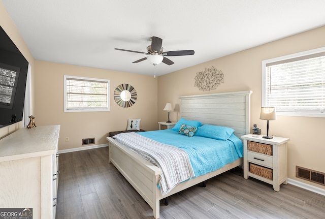 bedroom with ceiling fan and hardwood / wood-style floors