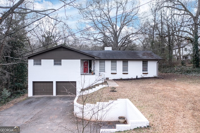 single story home with a garage