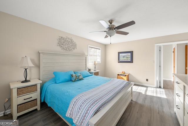 bedroom featuring dark hardwood / wood-style floors and ceiling fan