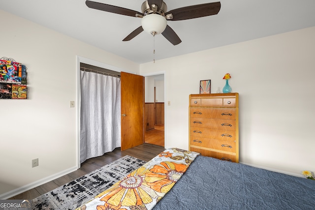 bedroom featuring dark wood-type flooring and ceiling fan