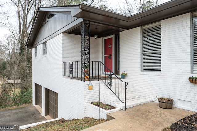 view of exterior entry featuring a garage