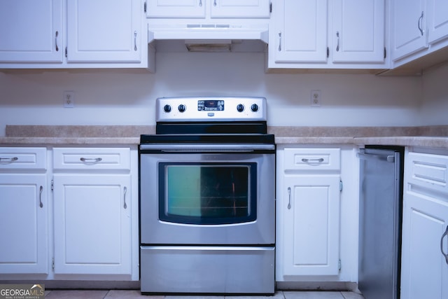 kitchen with white cabinetry and stainless steel electric range